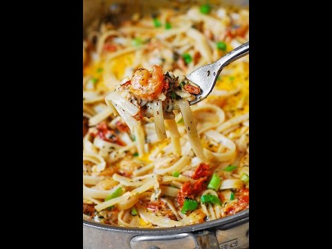 GARLIC SHRIMP AND SUN DRIED TOMATOES WITH PASTA IN SPICY CREAMY SAUCE